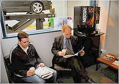 Customers in the waiting area beside the testing lanes